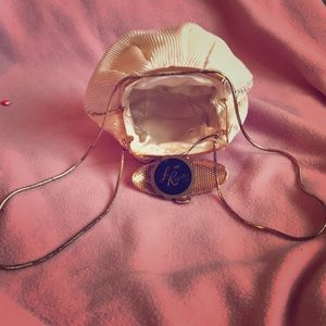 Small she'll shaped clutch